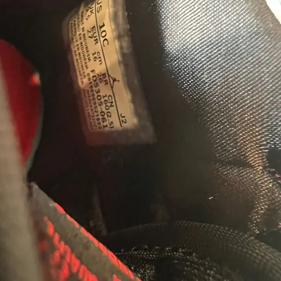 KIDS BLACK AND RED RETRO JORDAN 1  MID SIZE 10C. USED IN GOOD CONDITION.